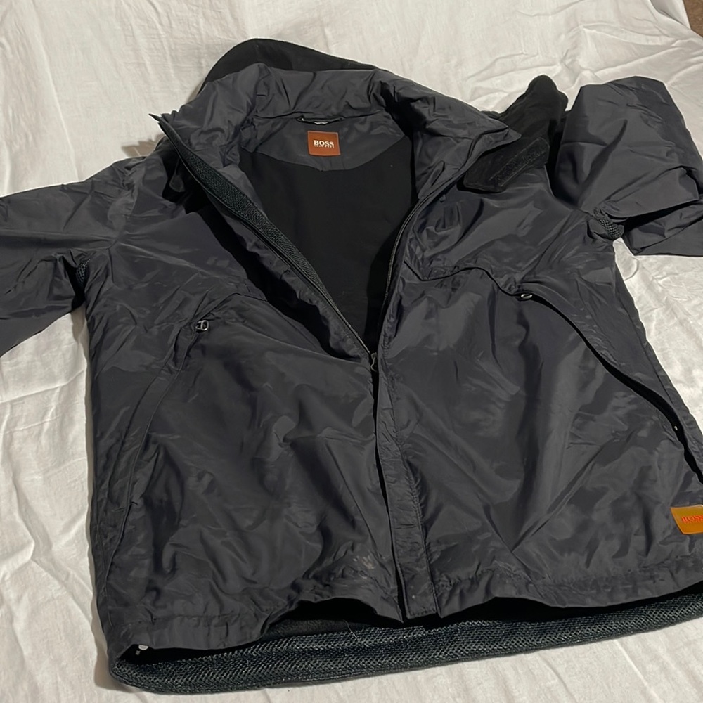 Hugo Boss lined winter coat with removable neck cover.